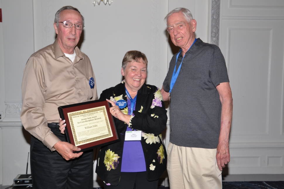 Mary Batcher, Chair of the National Institute of Statistical Sciences Board of Trustees awards William Eddy with the Jerome Sacks Award for Cross-Disciplinary Research at the 2016 NISS-JSM Awards Reception [Photo courtesy of the ASA]