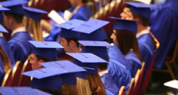 people in blue graduation caps